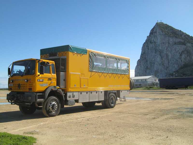 Overlanding truck with Gibraltar's rock in the distance