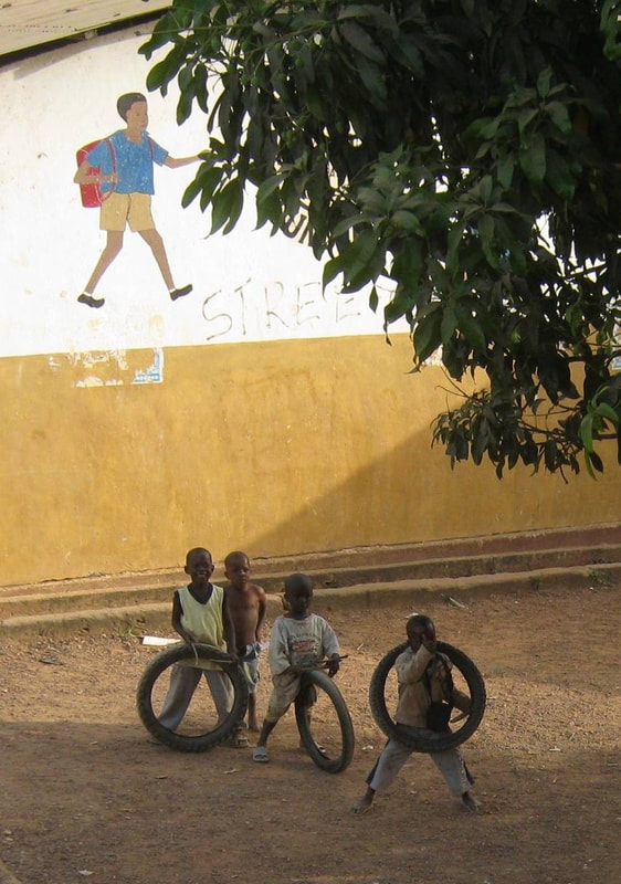 Young boys we interrupted who were playing with tires, Guinea
